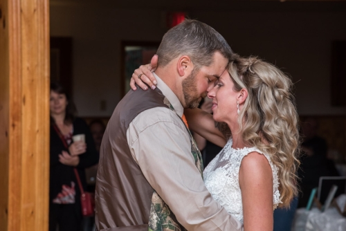 A bride and groom have their first wedding dance at their Salmon River Firehall wedding.