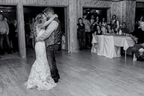 A bride and groom have their first wedding dance at the Salmon River Firehall in Nova Scotia.