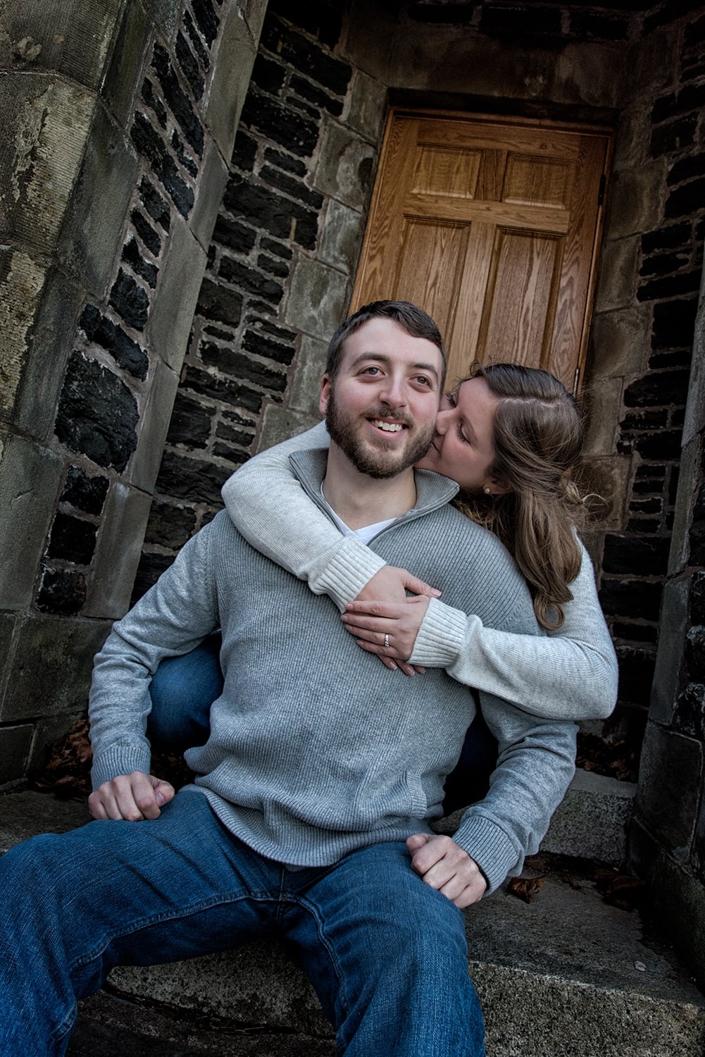A woman hugs her fiance during their engagement photos at Point Pleasant Park in Halifax, NS.
