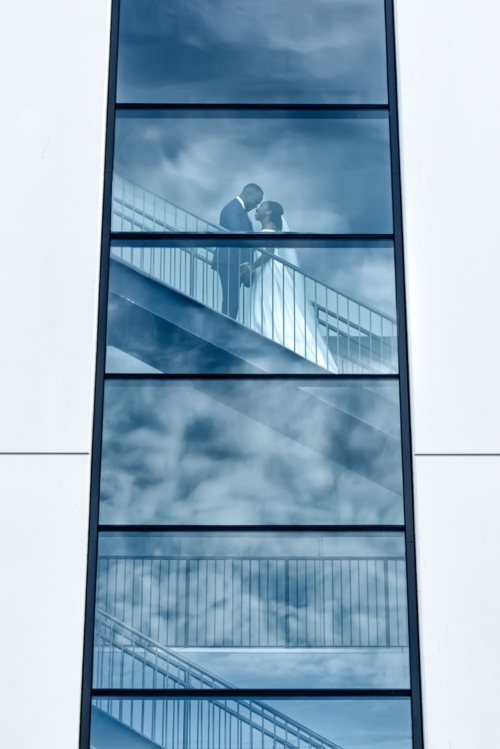 The bride and groom pose for their wedding photos amongst the clouds at the Cedar Events Center in Halifax NS.