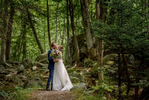 The bride and groom pose for stunning forest wedding photos at the Sir Sandford Fleming Park, captured by Halifax Wedding Photographers