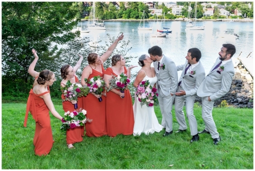The wedding party pose for fun wedding photos with the bride and groom at Saraguay House in Halifax NS.